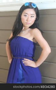 Pretty Chinese girl in a blue dress