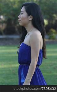 Pretty Chinese girl in a blue dress