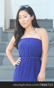 Pretty Chinese girl in a blue dress