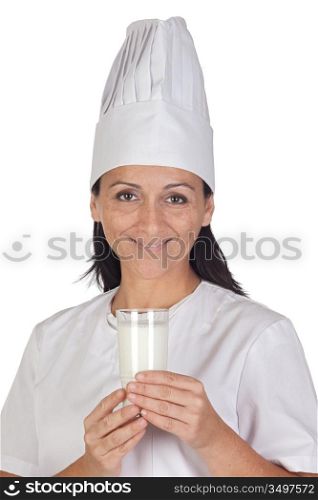 Pretty cook girl with a glass of milk isolated on white background