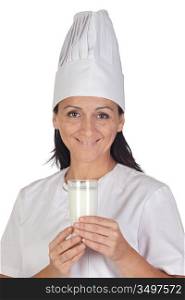 Pretty cook girl with a glass of milk isolated on white background