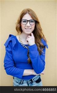 Pretty cool woman dressed in blue with big glasses