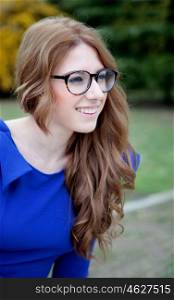 Pretty cool woman dressed in blue with big glasses&#xA;