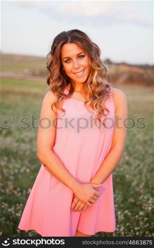 Pretty cool woman dressed in pink with a beautiful smile