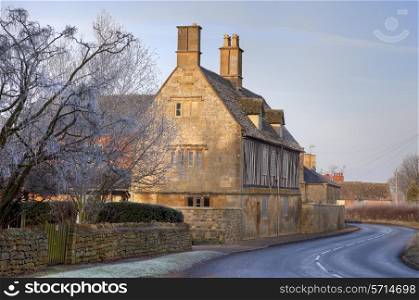 Pretty Cotswold farmhouse in wintertime, Gloucestershire, England.