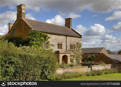 Pretty Cotswold stone farmhouse, Gloucestershire, England.