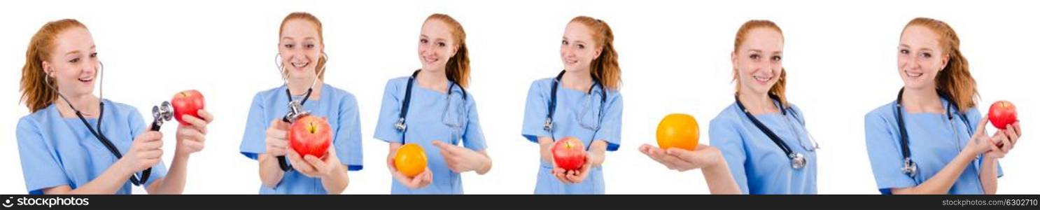 Pretty doctor in blue uniform with stethoscope and apple isolated on white. Pretty doctor in blue uniform with stethoscope and apple isola