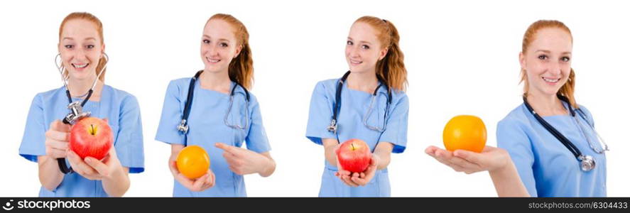 Pretty doctor in blue uniform with stethoscope and apple isolated on white. Pretty doctor in blue uniform with stethoscope and apple isola