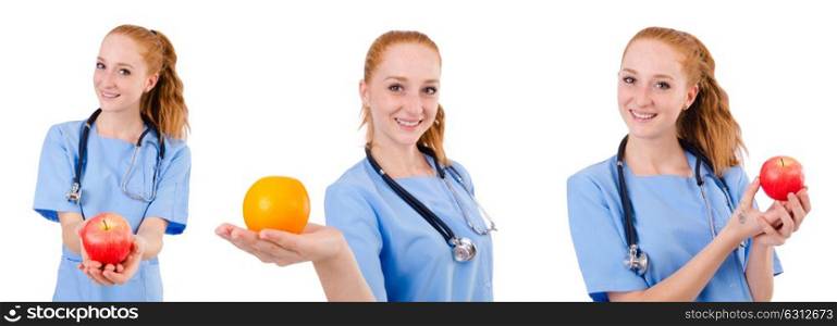 Pretty doctor in blue uniform with stethoscope and apple isolated on white. Pretty doctor in blue uniform with stethoscope and apple isola