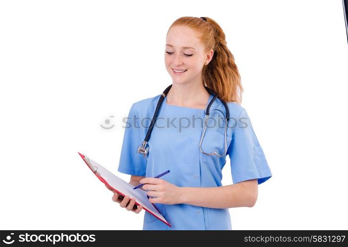 Pretty doctor in blue uniform writing in binder isolated on white&#xA;