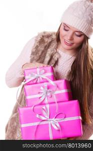 Pretty fashion woman with boxes gifts. Christmas.. Pretty happy fashion woman in hat with pink rose boxes gifts isolated on white. Christmas xmas winter time season concept.