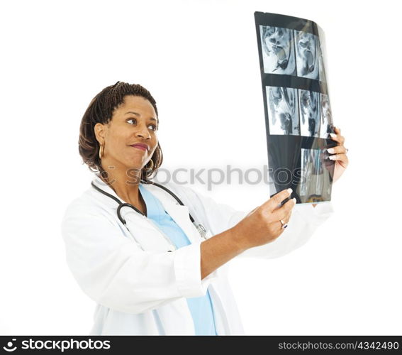 Pretty female doctor checking out a patient&rsquo;s CT scan.