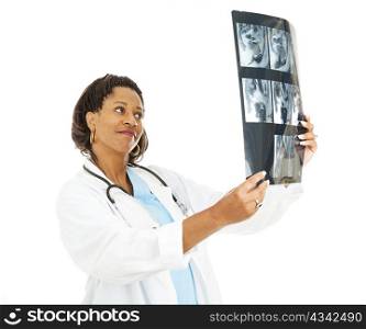 Pretty female doctor checking out a patient&rsquo;s CT scan.
