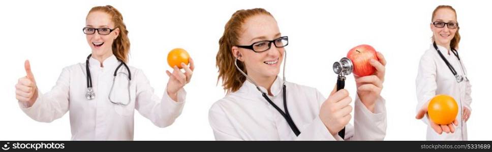 Pretty female doctor with stethoscope and orange isolated on whi. Pretty female doctor with stethoscope and orange isolated on white