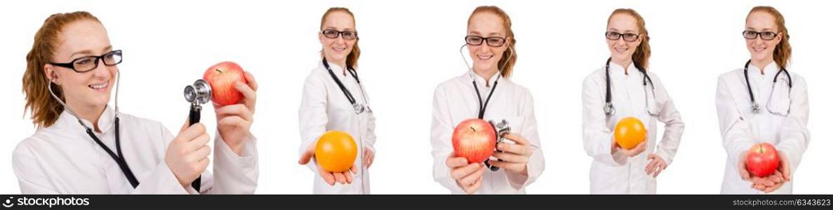 Pretty female doctor with stethoscope and orange isolated on whi. Pretty female doctor with stethoscope and orange isolated on white