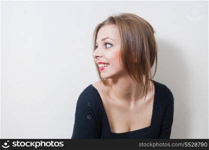 pretty female indoor smiling and looking away