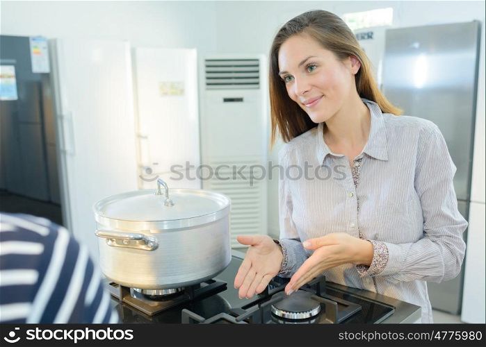 pretty female selling kitchenware