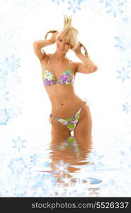 pretty girl in princess crown and bikini in water