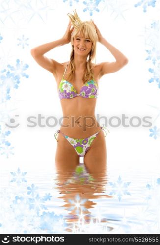 pretty girl in princess crown and bikini in water
