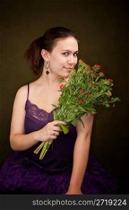 Pretty Girl in Purple on Green Background with Flowers