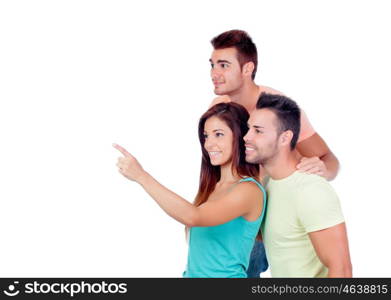 Pretty girl indicating something with two handsome boys isolated on a white background