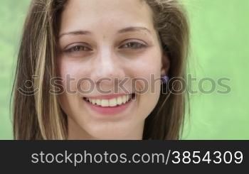 Pretty girl smiling, portrait of happy young hispanic teen looking at camera