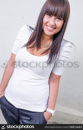 pretty girl standing in front of wall