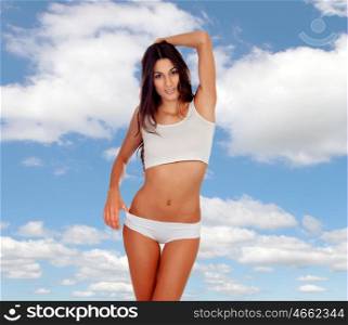 Pretty girl with a beautiful bikini with a sky of background