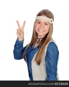 Pretty girl with hippie clothes making the peace symbol isolated on white background