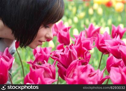 Pretty girl with tulips with soft background