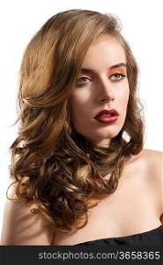 pretty girl with wavy hair and red lipstick, she is turned of three quarters at left and looks in front of her