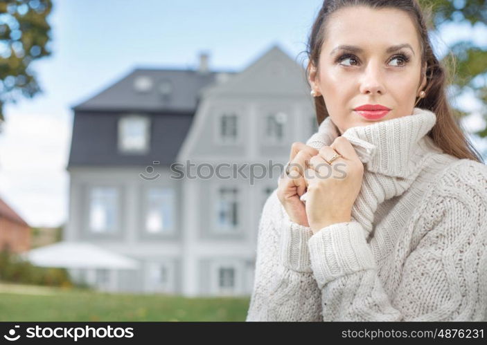 Pretty lady wearing thick woolen sweater