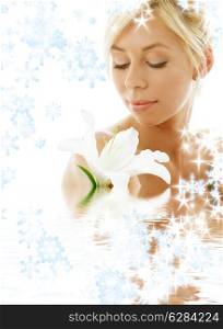 pretty lady with madonna lily in water with snowflakes
