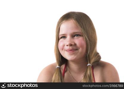 Pretty little blond girl trying not to smile