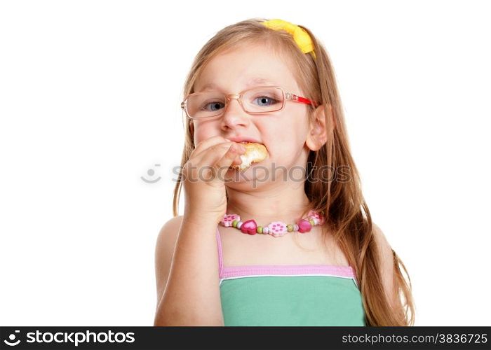 Pretty little girl in glasses eating a bread doing fun isolated on white background