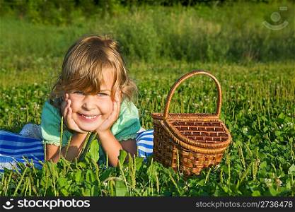 pretty Little Girl with basket on glade