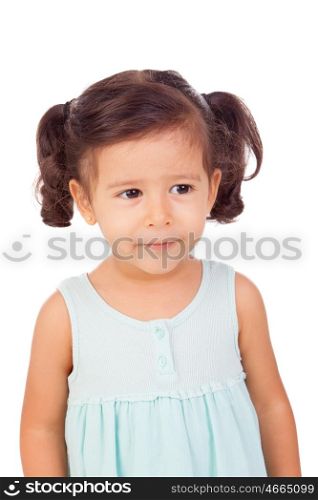 Pretty little girl with blue dress looking at side isolated on a white background