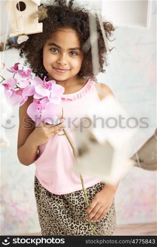 Pretty little lady holding a flower