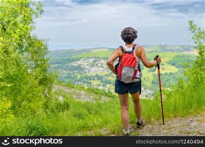 pretty mature woman go hiking in the mountains
