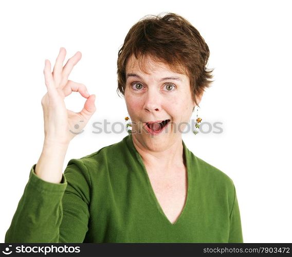 Pretty, mature woman with a pixie cut smiles and gives the Okay hand sign. Isolated on white.