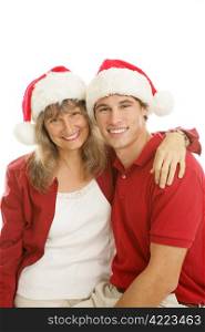 Pretty middle aged mom and her handsome college aged son, together for Christmas. White background.