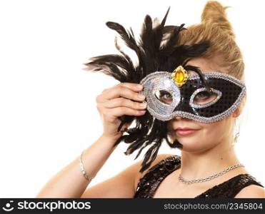 Pretty mysterious woman wearing black carnival mask with feathers. Female being ready for party.. Mysterious woman wearing carnival mask