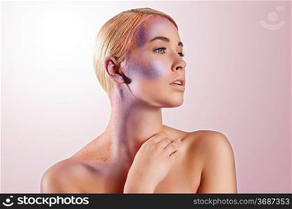 pretty nice beauty portrait of girl with a creative colored make up over white