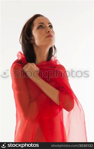 Pretty nude brunette wrapped in red cloth