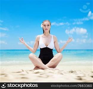 Pretty pale lady meditaitng on a exotic beach