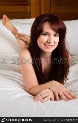 Pretty pale redhead nude in bed