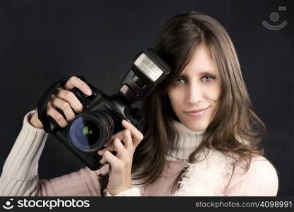 Pretty photographer with a professional camera and flash