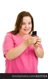 Pretty plus sized model amazed by the features of her new cell phone, or by a text message she&rsquo;s reading. Isolated on white.