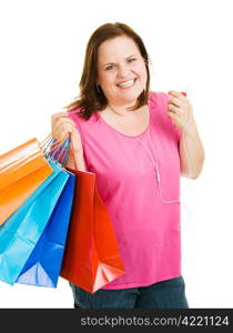 Pretty plus-sized woman shopping and enjoying music on her mp3 player. Isolated on white.