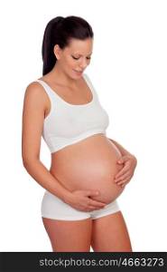 Pretty pregnant woman belly in underwear caressing her baby isolated on white background